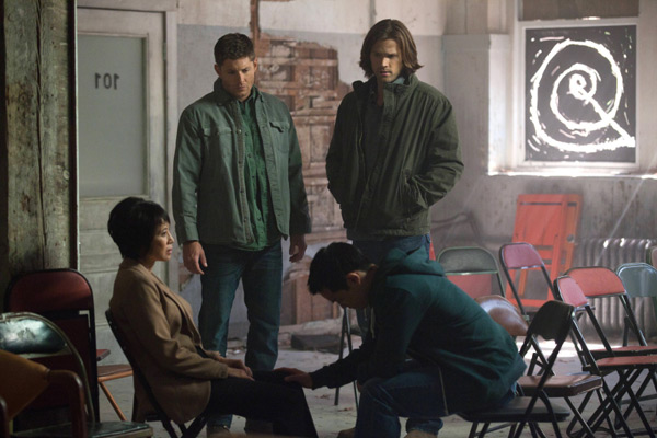 Lauren Tom as Ms Tran, Jensen Ackles as Dean, Jared Padalecki as Sam, and Osric Chau as Kevin — Credit: Liane Hentscher/The CW — © 2012 The CW Network.